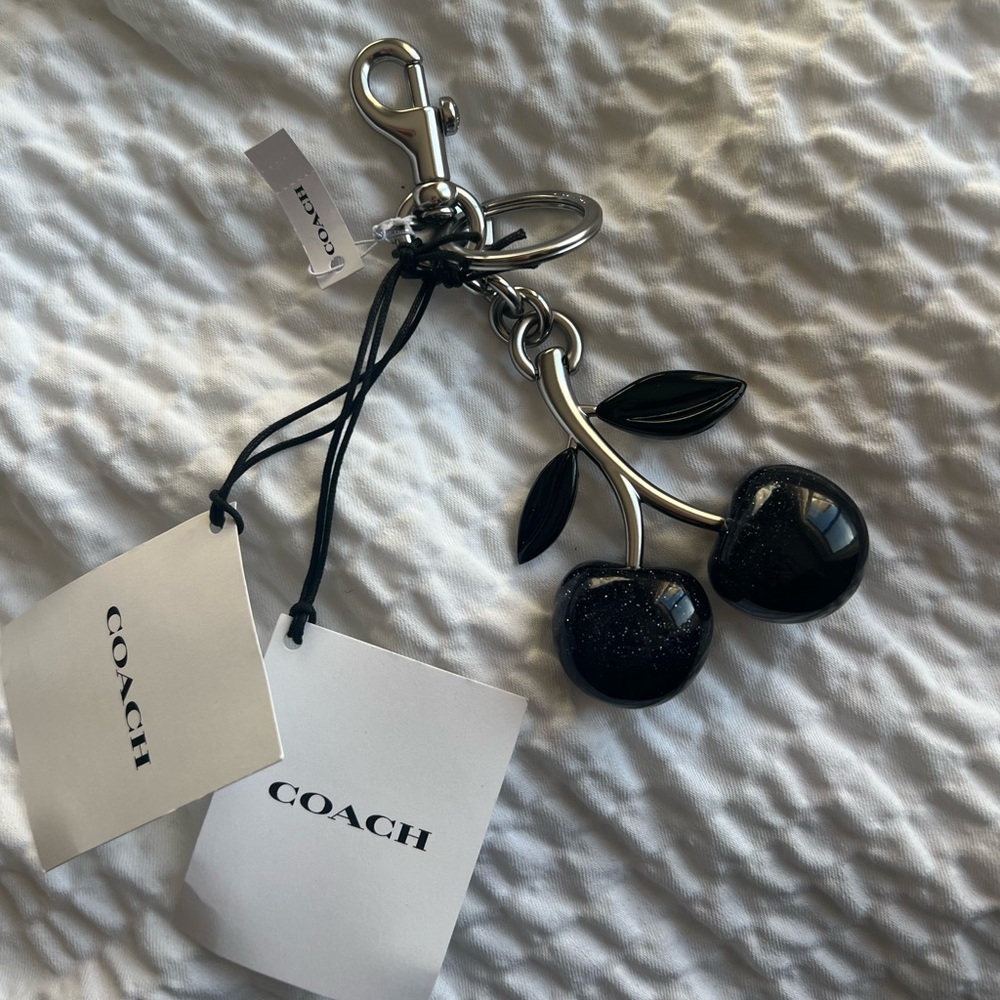 Coach black cherry charm